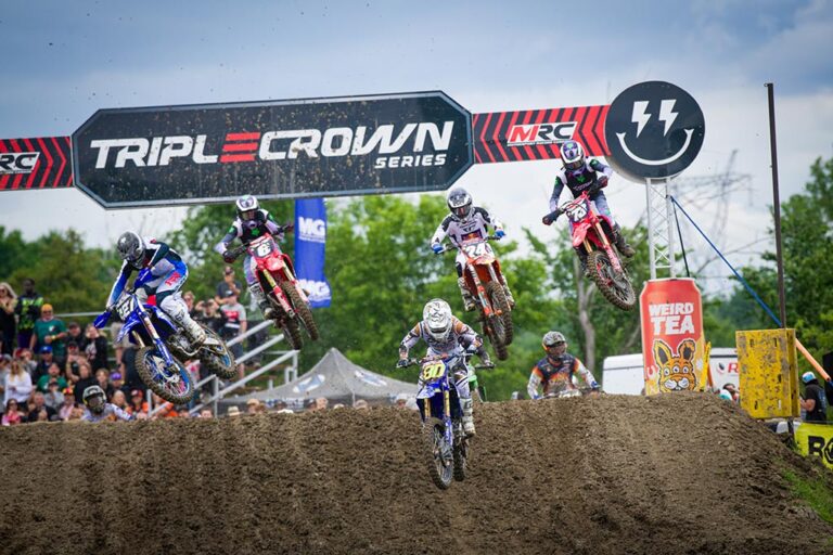 Riders going over a jump near the start of the 250 moto at Ste-Julie, QC.