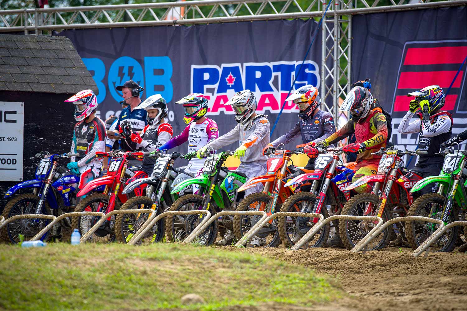 Riders preparing to start a motocross race.