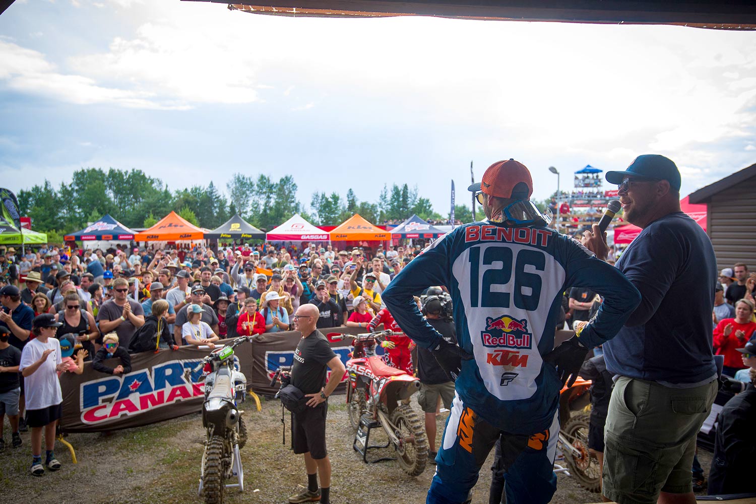 Interviewing a rider on stage in front of a crowd.